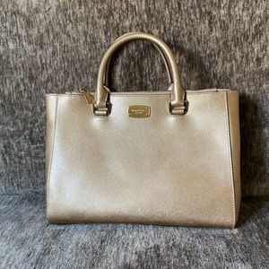 Gold Michael Kors Purse with shoulder strap